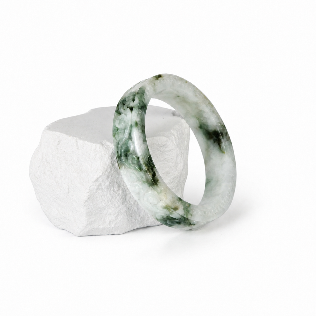 Hand-Carved Moss-in-Snow Jadeite Bangle, display view